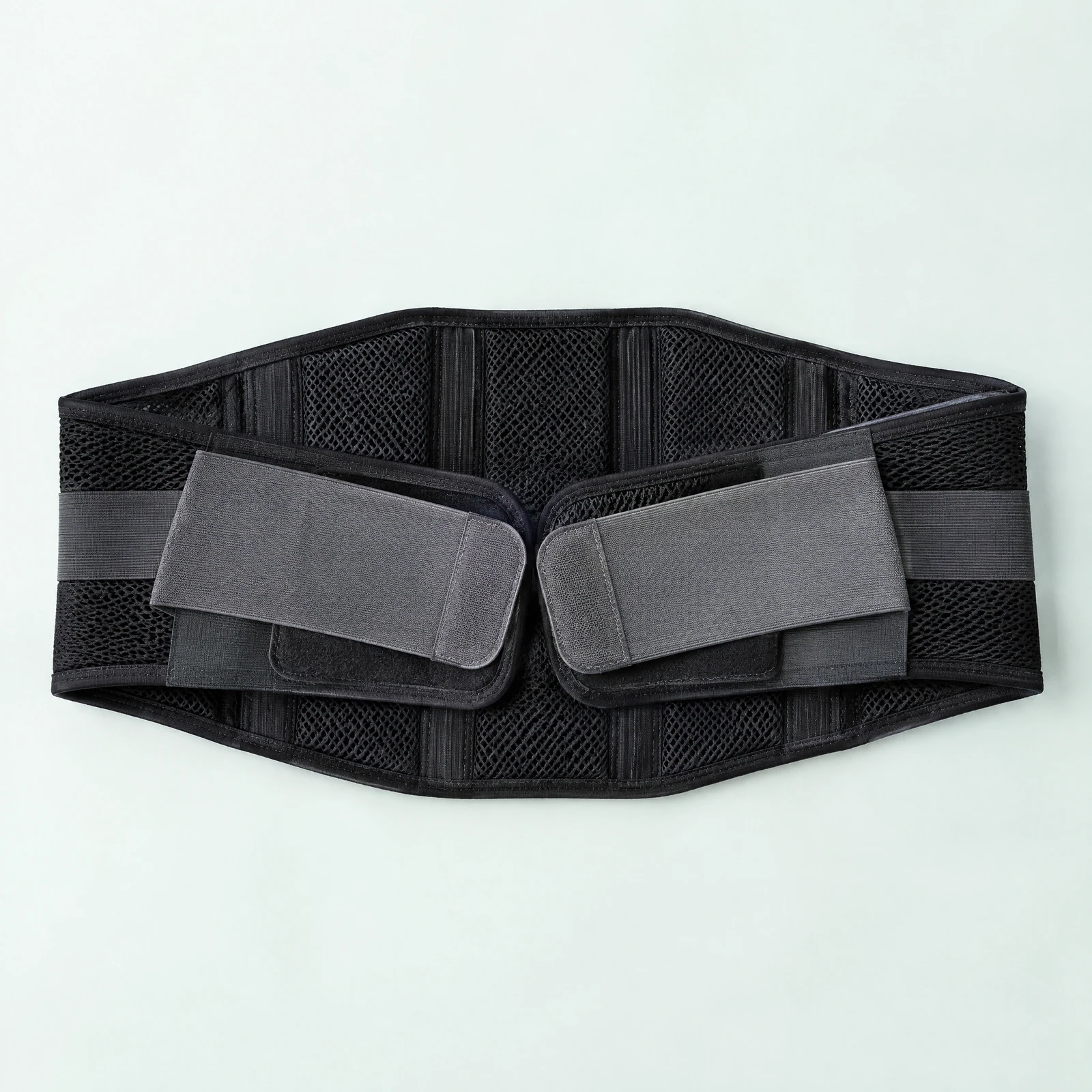 Black open-weave lumbar support belt with two gray hook-and-loop straps laid flat
